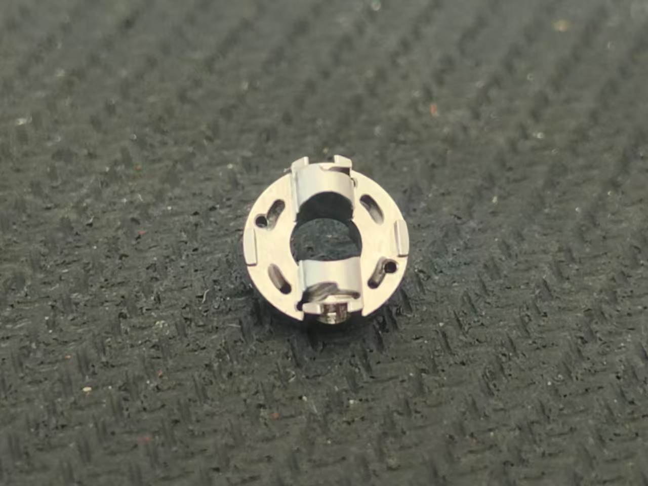 Machined aluminum housing plates arranged in protective foam