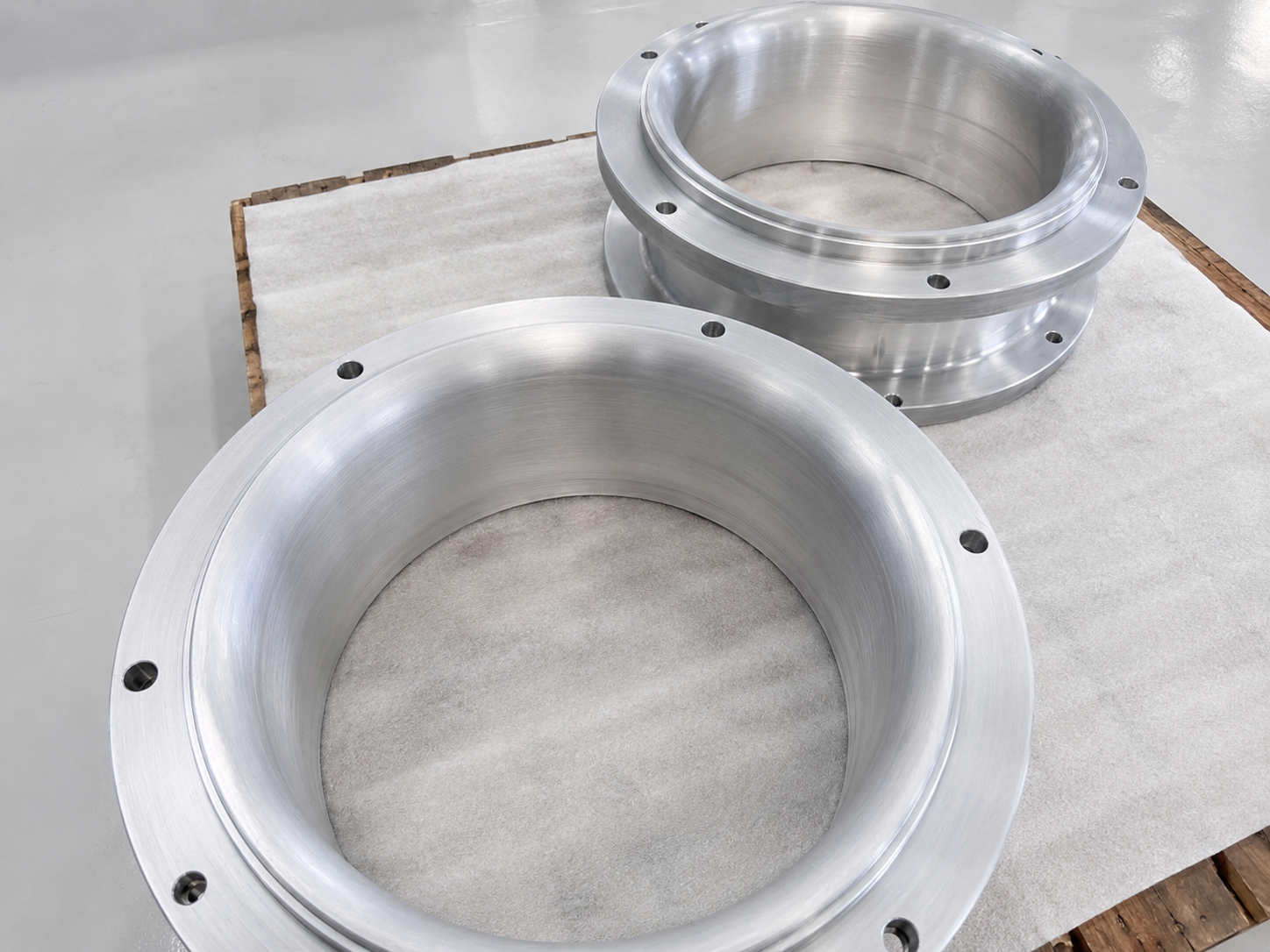 Large turned aluminum rings with machined circular surfaces